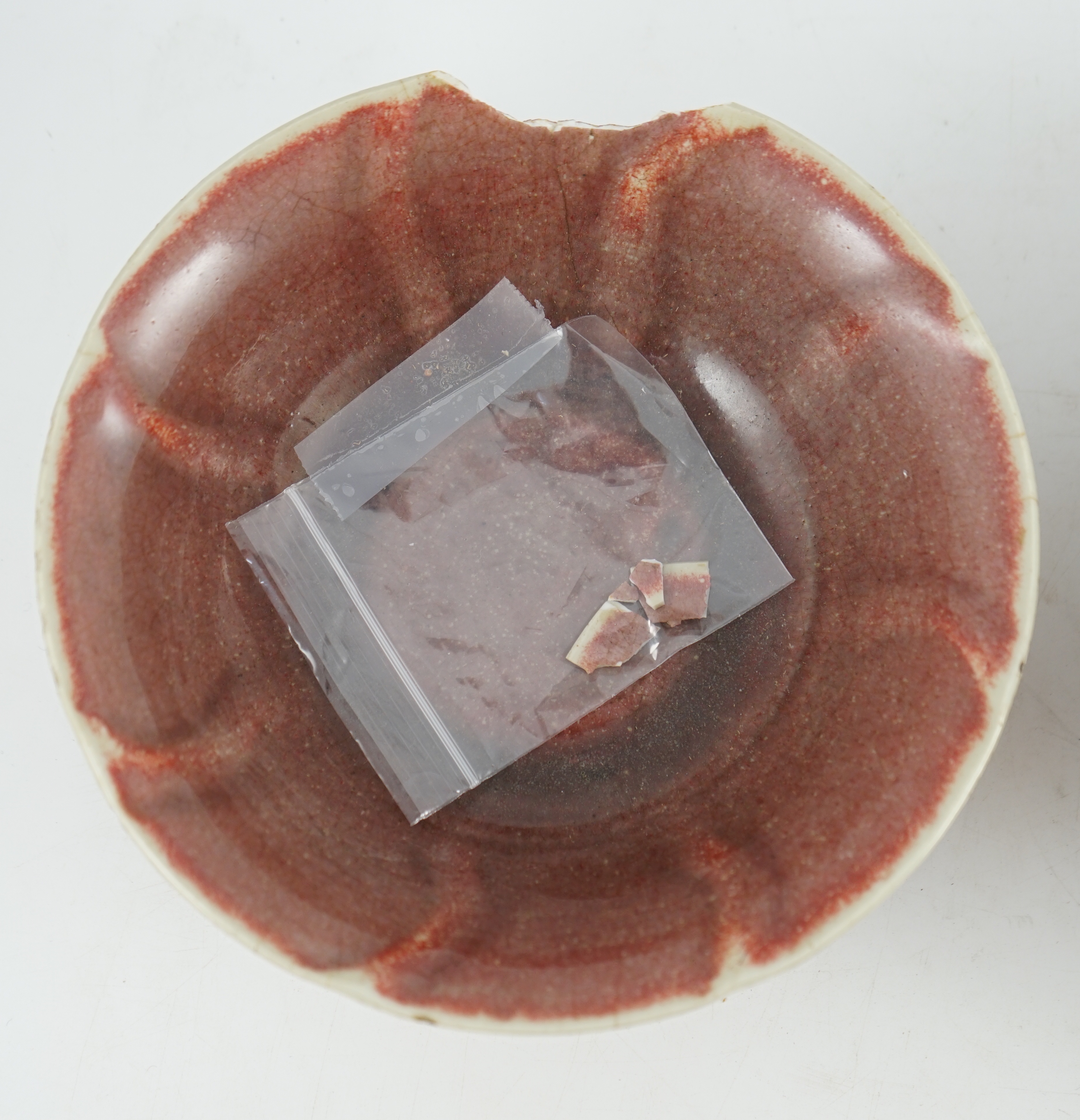 A pair of Chinese sang-de-boeuf glazed bowls, Langyao hong, Kangxi period, 19.5 cm diameter, some damage